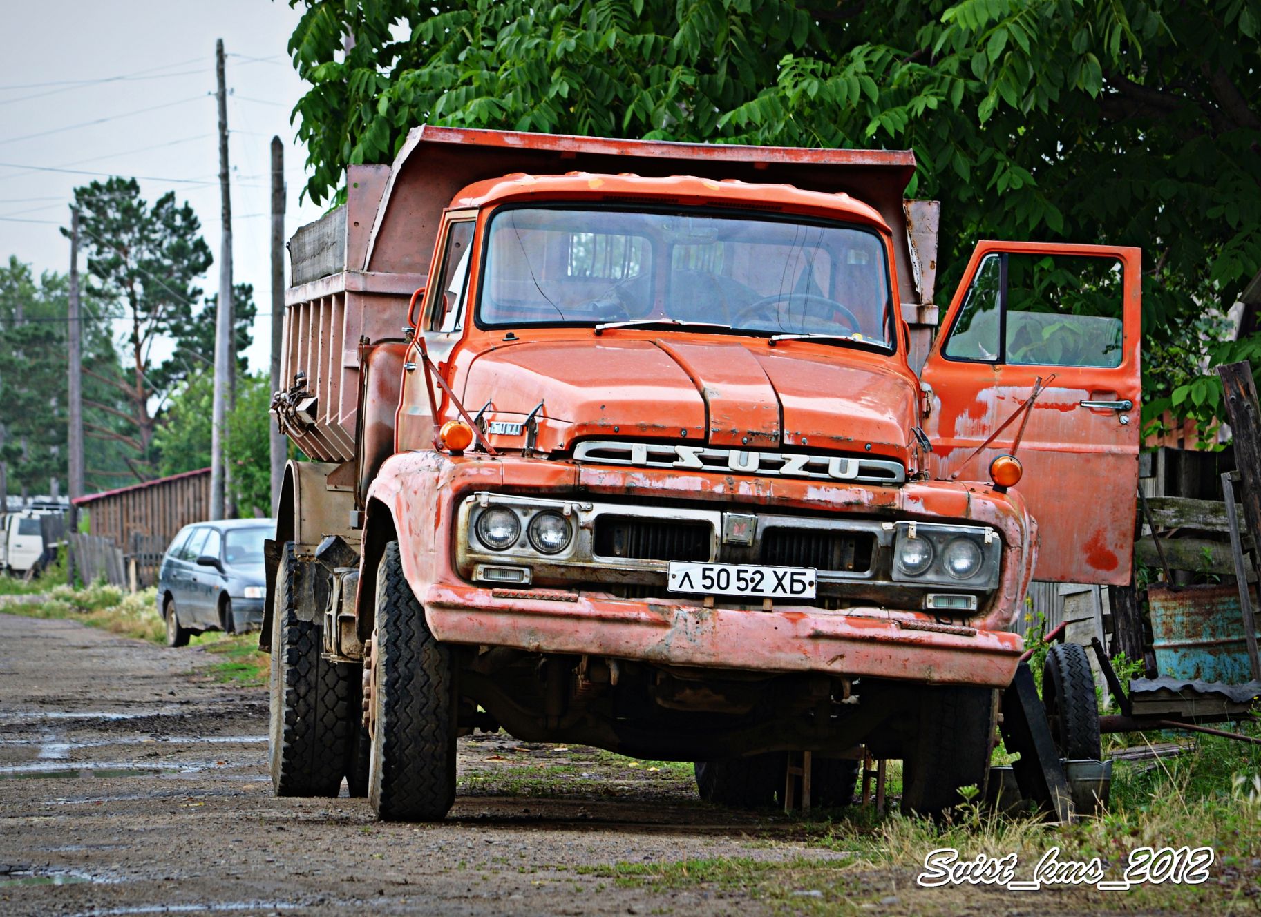 Самосвал Isuzu td50. Ниссан 80 грузовик. Komatsu-Nissan Diesel KNWF-12t. Исудзу самосвал 1970.